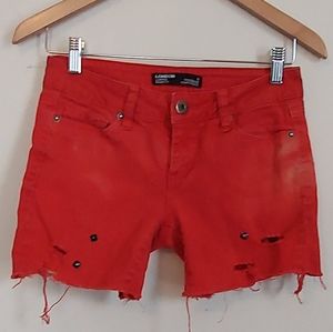 Red distressed shorts